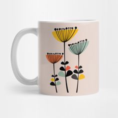 a coffee mug with flowers painted on it