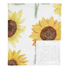 the sunflowers on this blanket are yellow and brown