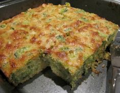 a piece of broccoli casserole sitting on top of a metal pan