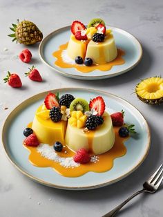 two white plates topped with desserts covered in fruit