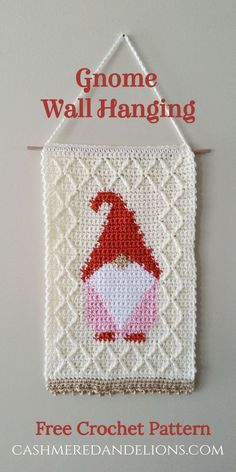 a crocheted wall hanging with an image of a gnome on it and the words gnome