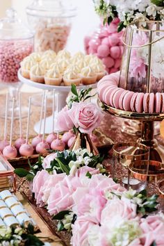 an assortment of desserts and pastries on display at a wedding or bridal party