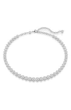 Round-cut Swarovski crystals glow in puffy settings on this emboldened take on the classic tennis necklace. 18" length Lobster clasp closure Rhodium plate/Swarovski crystal Made in Austria Swarovski Tennis Necklace, Tennis Necklace, Swarovski Crystal, Rhodium Plated, Lobster Clasp, Austria, Round Cut, Swarovski Crystals, Tennis