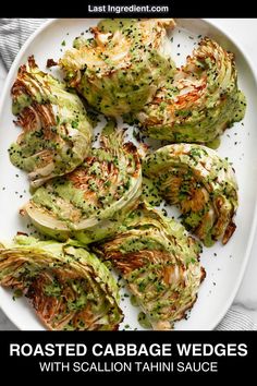 roasted cabbage wedges with scallion tahiti sauce on a white platter