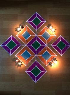 an overhead view of some lights on a wooden floor with squares and rectangles