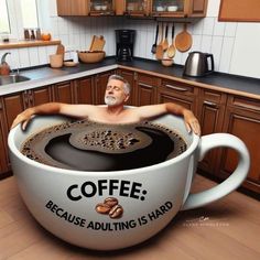 a man sitting in a coffee cup with the words coffee because adulting is hard