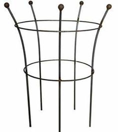 a round metal rack with four balls on the top and two poles at the bottom