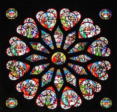 a large stained glass window with many different colors