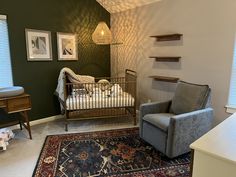 a baby crib in the corner of a room with a rug on the floor