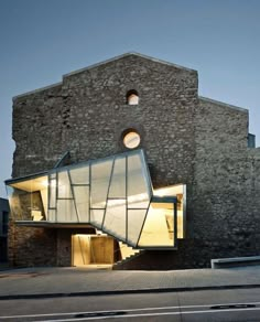 an old brick building that has been converted into a modern home