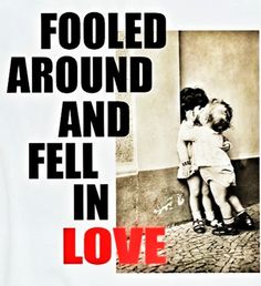 two children hugging each other in front of a poster with the words, fooled around and fell in love