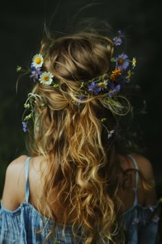 a woman with long hair and flowers in her hair