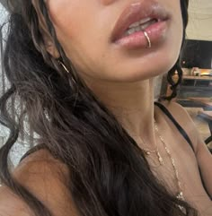 a close up of a woman with her nose piercing