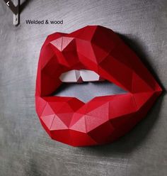 a paper sculpture of a woman's lips with the word wedded & wood on it