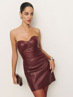 Romance for one. Shop the Veda Olivia Leather Dress from Reformation, a strapless mini dress with a sweetheart neckline and bust cup seams. Chic Mini Strapless Dress With Lined Bodice, Strapless Dress With Lined Bodice For Date Night, Lined Mini Dress With Sweetheart Neckline, Fitted Bodice Mini Dress With Boning For Date Night, Chic Strapless Mini Dress With Fitted Bodice, Strapless Mini Dress With Fitted Bodice And Lining, Date Night Strapless Dress With Fitted Bodice, Mini Dress With Fitted Bodice, Straight Neckline, And Lining, Strapless Dress With Fitted Bodice And Lining