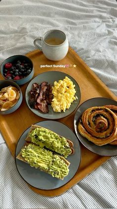 the breakfast is prepared and ready to be eaten on the bed in front of you