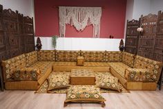 a living room filled with lots of wooden furniture