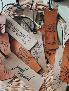 some brown tags with writing on them in a basket