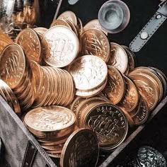 a bunch of coins sitting in a box