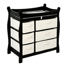 a black and white toy chest with four bins on the bottom, and two drawers below it