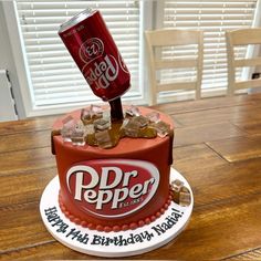 a birthday cake made to look like a dr pepper can with ice cubes on top