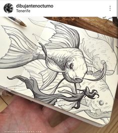 a drawing of a fish on a piece of paper