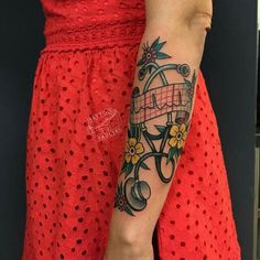 a woman with a tattoo on her arm