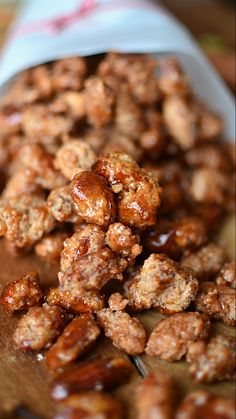 nuts are sitting on top of a wooden cutting board