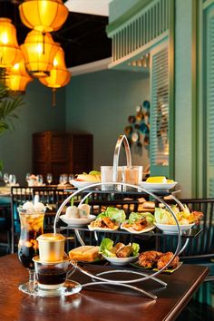 a table filled with food and drinks on top of it's sides in a restaurant