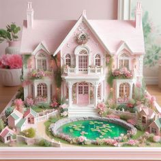 a pink doll house with lots of windows and flowers on the front, sitting on top of a wooden table