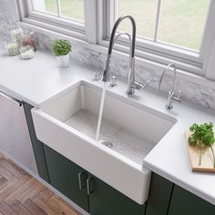 a white kitchen sink sitting under a window next to a cutting board with vegetables on it