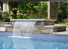 a pool with a waterfall in the middle