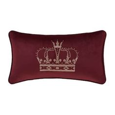 a red pillow with a crown on it