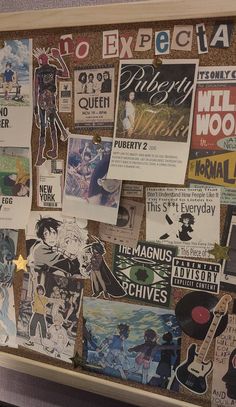 a bulletin board covered in posters and stickers