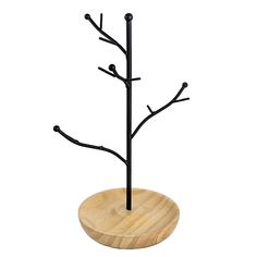 a wooden stand with two black branches on it