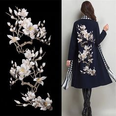 the woman is wearing a coat with flowers on it