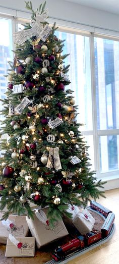 a small christmas tree with presents under it