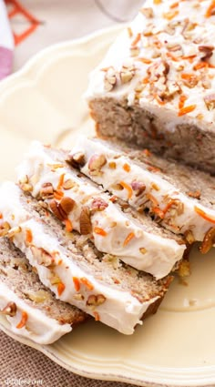 slices of carrot cake sitting on top of a white plate