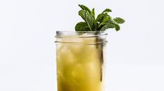 a glass filled with lemonade and mint