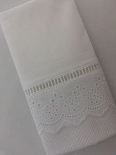 a white towel hanging on the wall