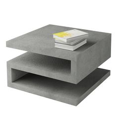 two concrete tables stacked on top of each other, one with a book on it