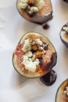 figs with chocolate sauce and nuts on them