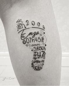 a person with a tattoo on their leg that has numbers and words written in it