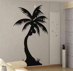 a living room with a palm tree on the wall