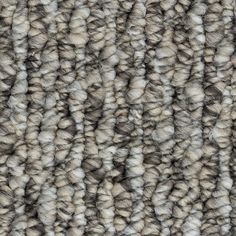 an up close view of the texture of a carpet with grey and white stripes on it