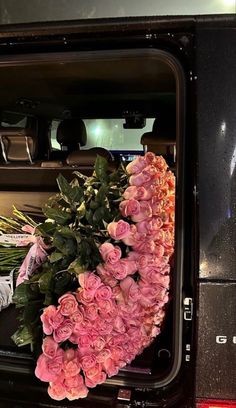 flowers are placed in the back of a truck