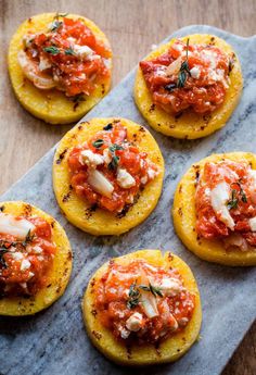 small appetizers with tomato sauce and cheese on top