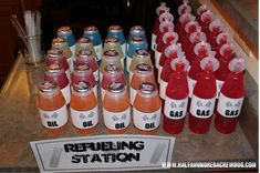 there are many bottles of sodas on the counter top, and one has a sign that says repubbling station