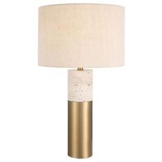 a white and gold lamp with a beige shade