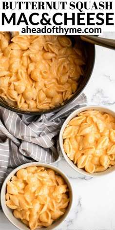 three bowls filled with macaroni and cheese on top of a marble counter